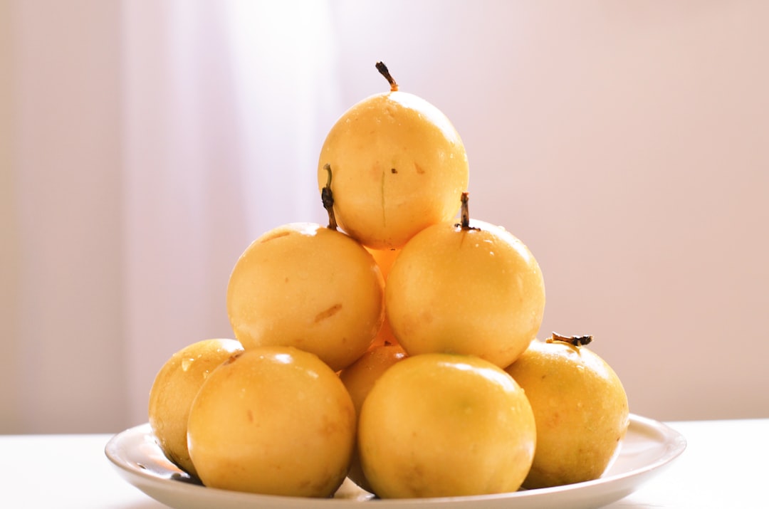 Asian Pear - yellow passion fruits in bowl