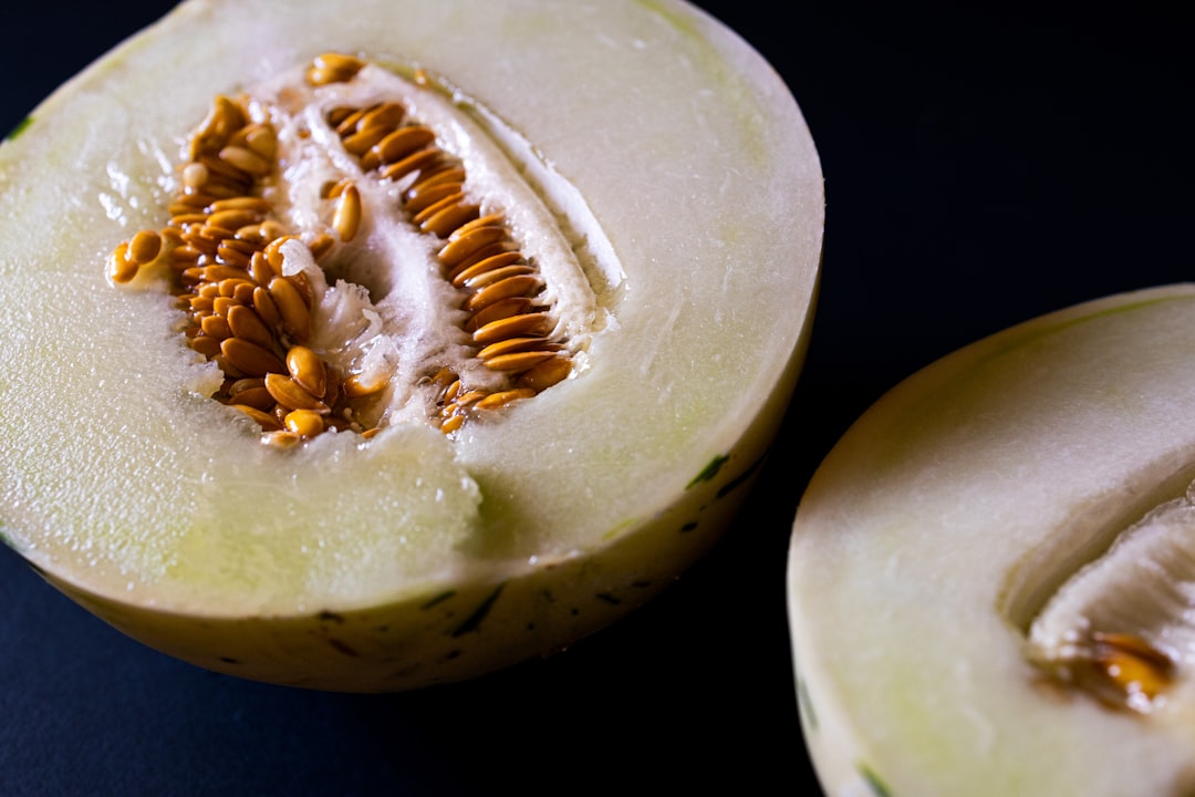 Honeydew - A halved honeydew melon with seeds visible