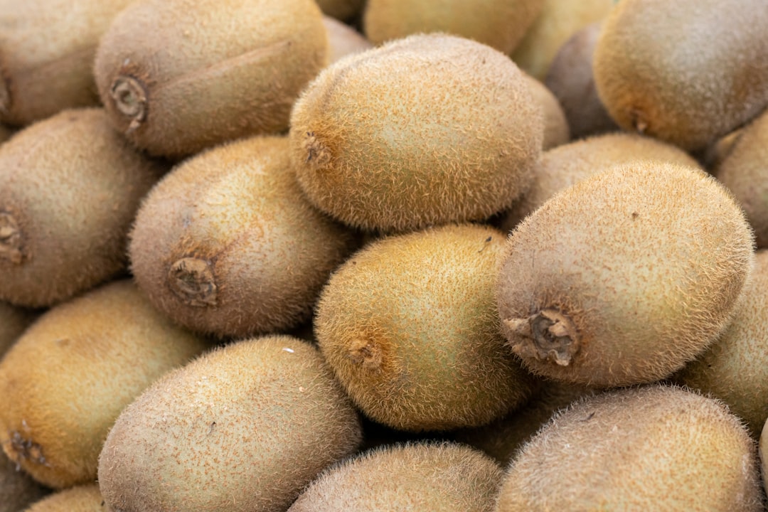 Kiwifruit - a pile of kiwi fruit sitting on top of each other