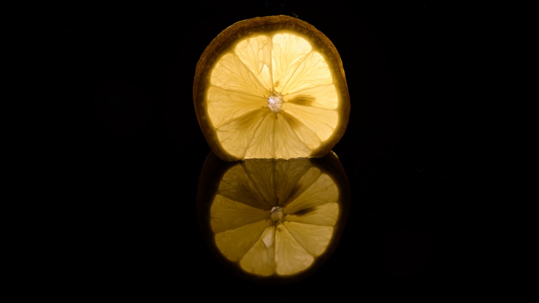 Lemon - a slice of lemon sitting on top of a table