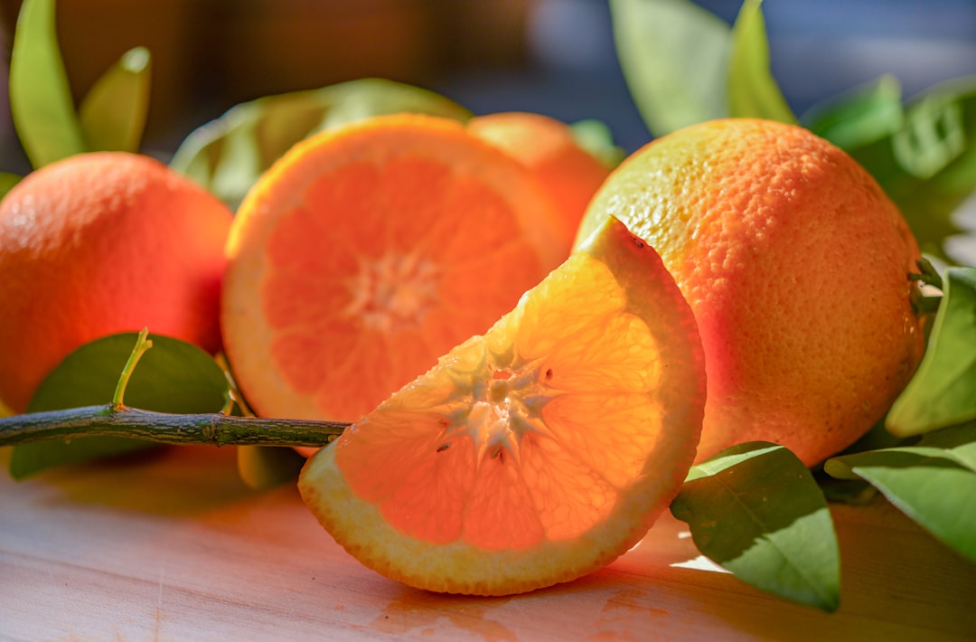 Orange - a group of oranges sitting on top of a table