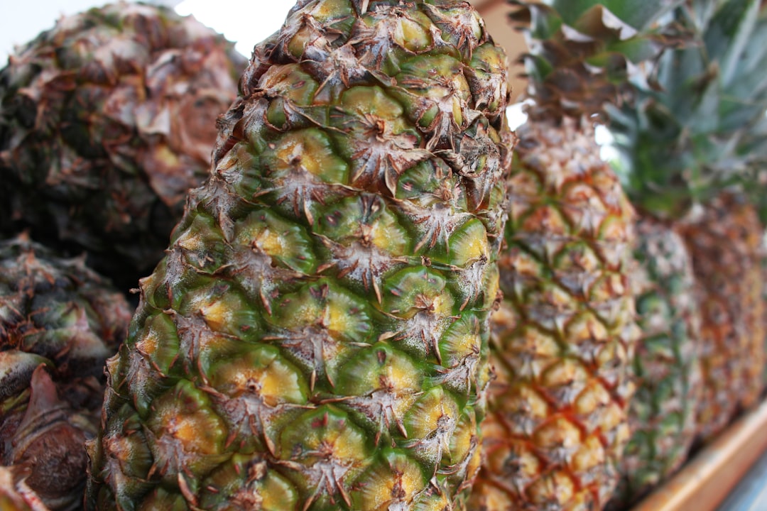 Pineapple - Several ripe pineapples displayed in a market