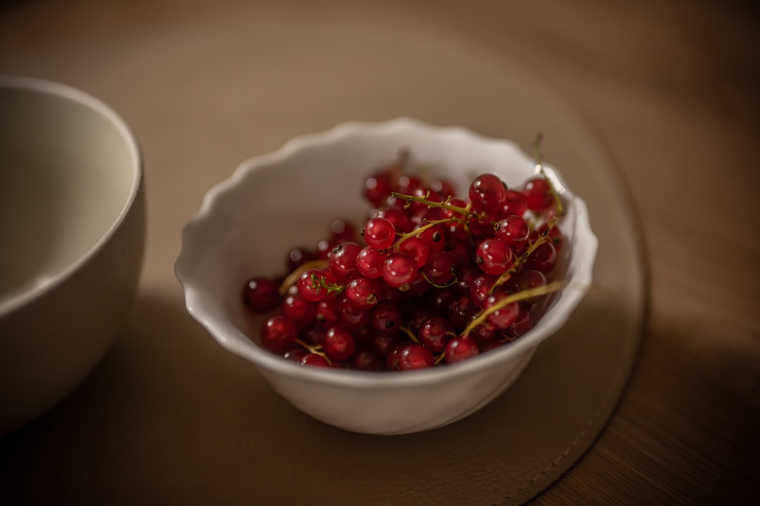 Red Currant - A bowl of fresh red currants on a table
