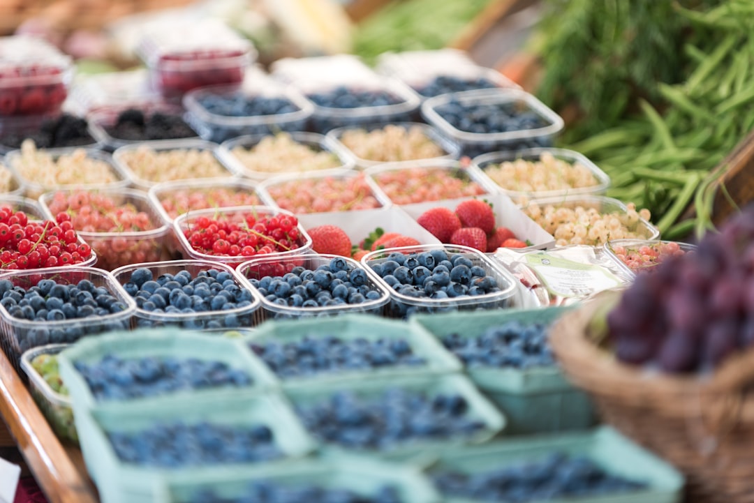 Red Currant - selective focus photography of assorted fruits on plastic food containers
