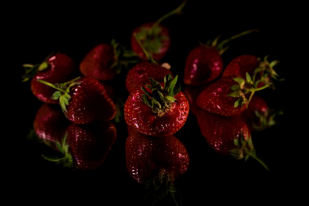 Strawberry - a group of strawberries sitting on top of a table