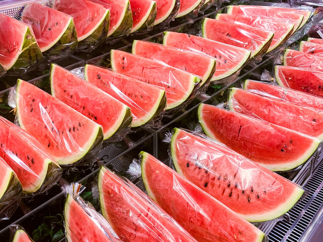 Watermelon - sliced watermelon on stainless steel tray